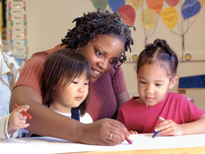 Preschool teacher with children