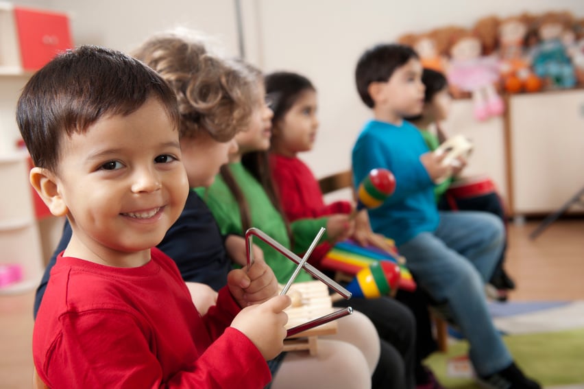 Preschool age children in music class